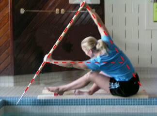 Dragon boat stroke A frame Woman holding paddle with paddle, arms, and back forming A frame