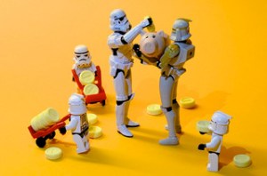 stormtroopers loading piggy banks with coins